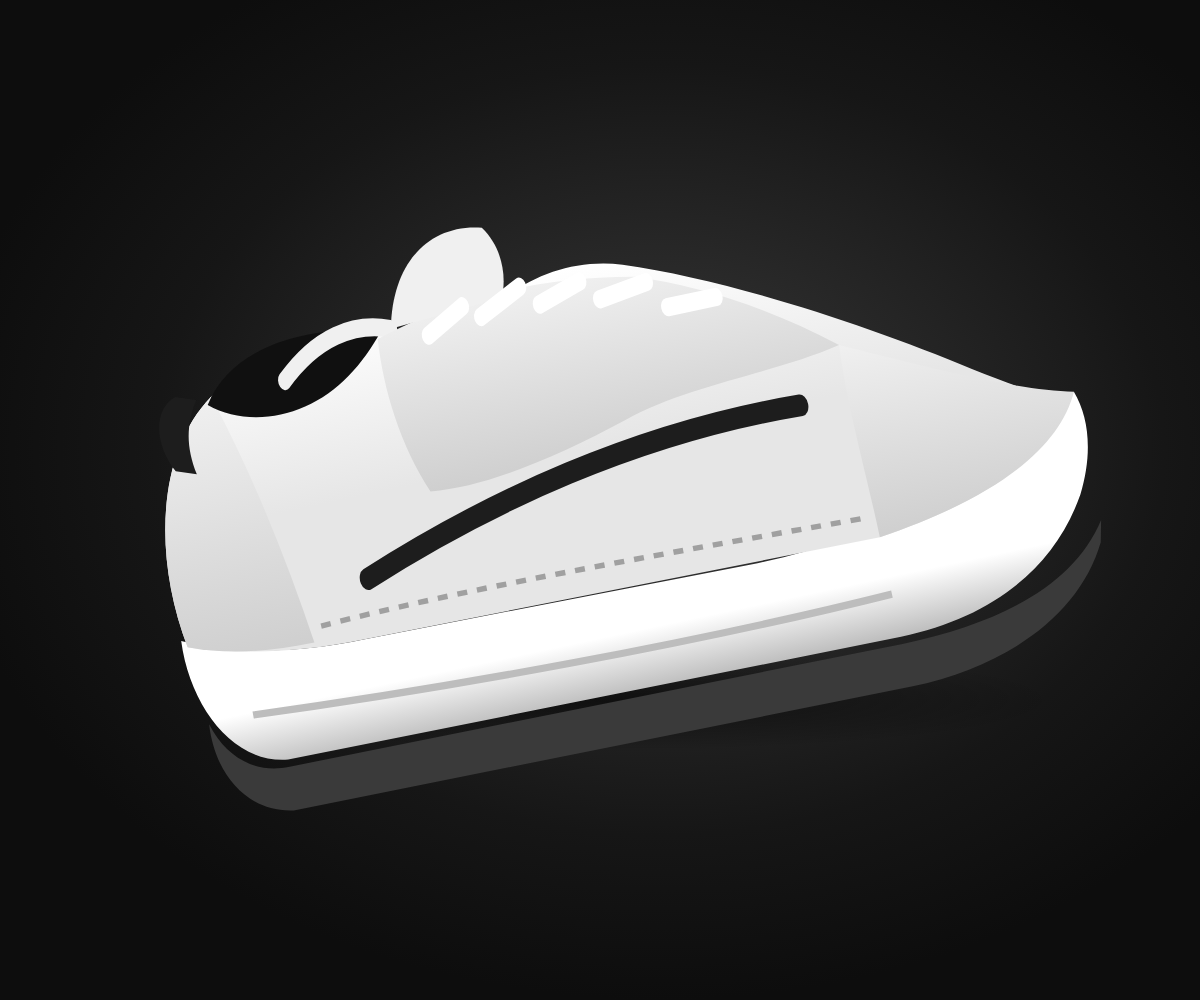 A white running shoe on a dark studio floor