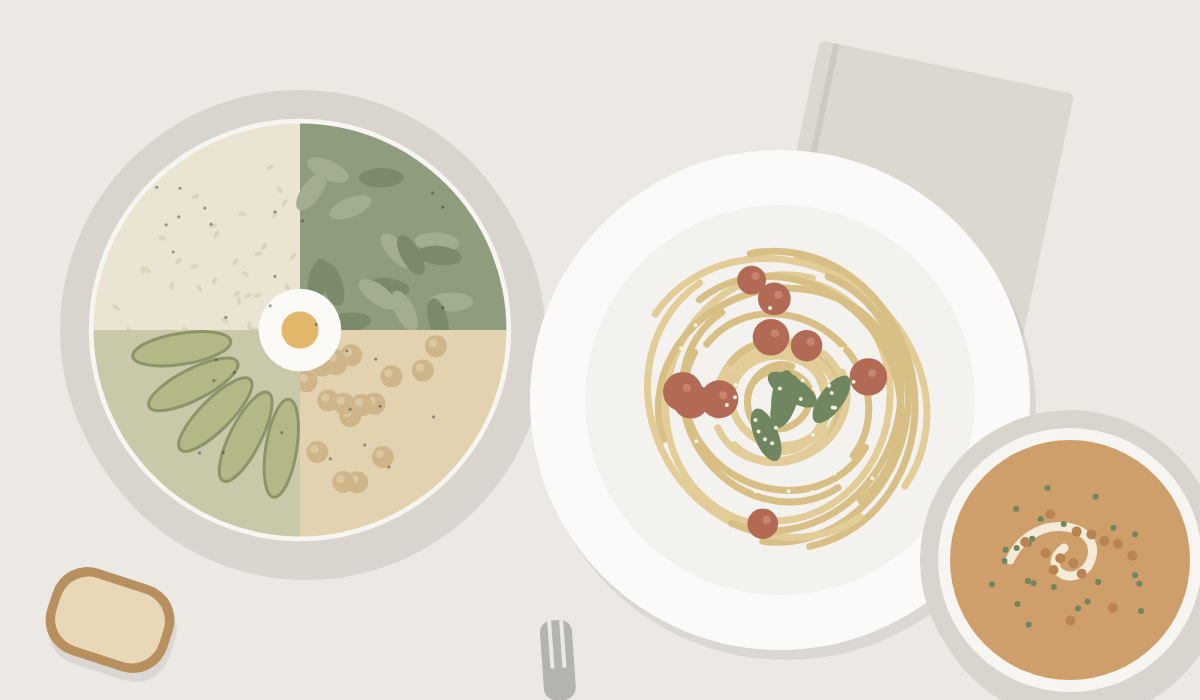 A grain bowl, a plate of rigatoni and a bowl of soup on a linen table, seen from above